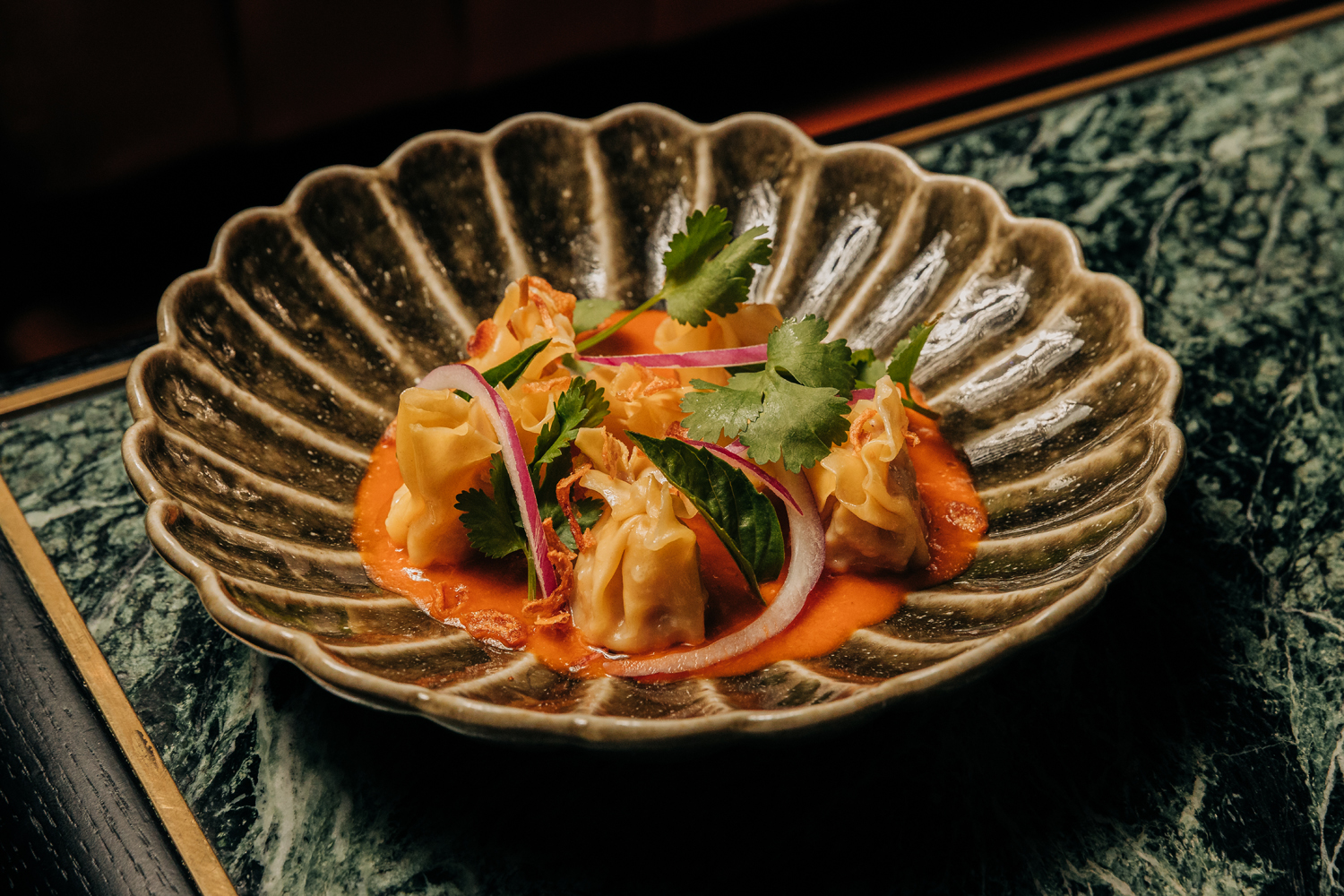 Red curry shrimp and pork dumplings at Crying Tiger Chicago