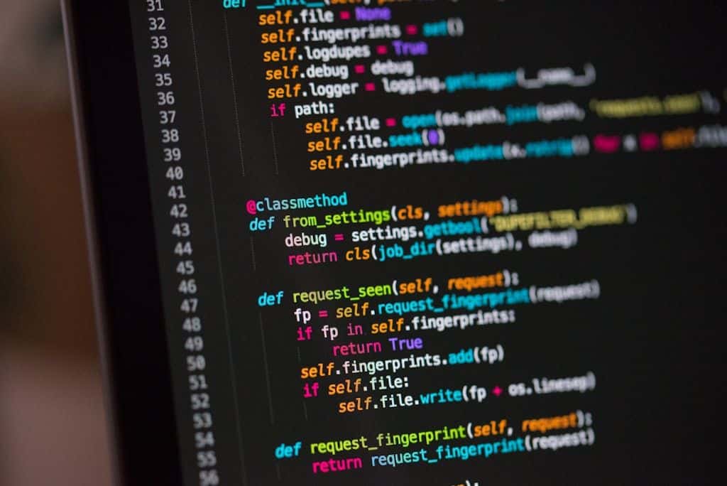 Colorful programming code displayed on a screen.