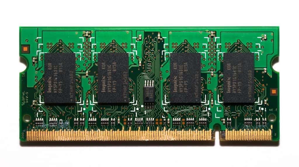 A close-up of a computer memory module showing its chips.