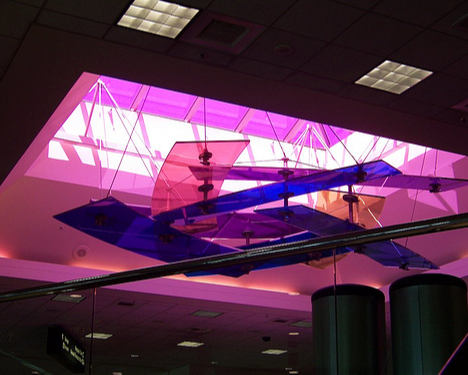 It suspended horizontally from the ceiling under a colored skylight