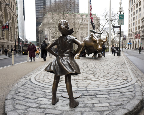 Fearless Girl stands in defiance to the Charging Bull