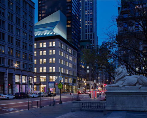 The renovated Library across the NYPL at Bryant Park, at night