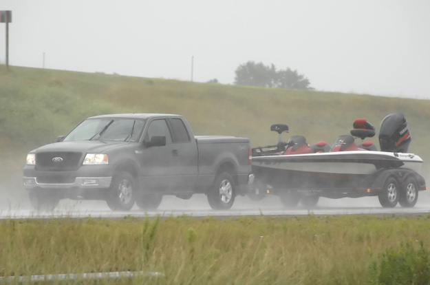 Truck towing boat trailer through rain with CURT custom wiring Truck towing boat trailer through rain with CURT custom wiring