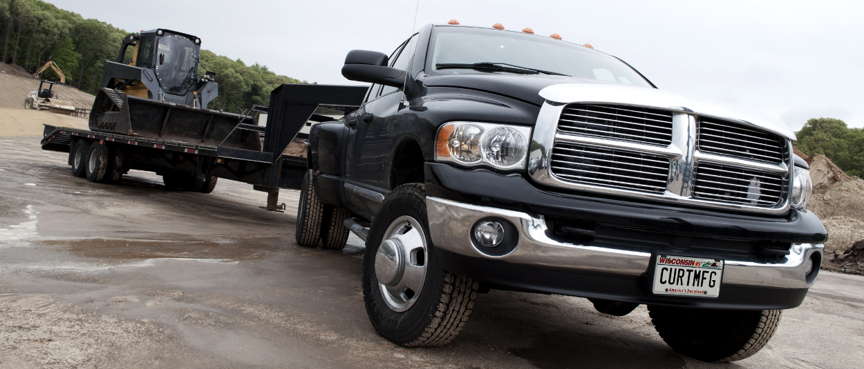 CURT gooseneck hitches - Ram work truck towing construction site