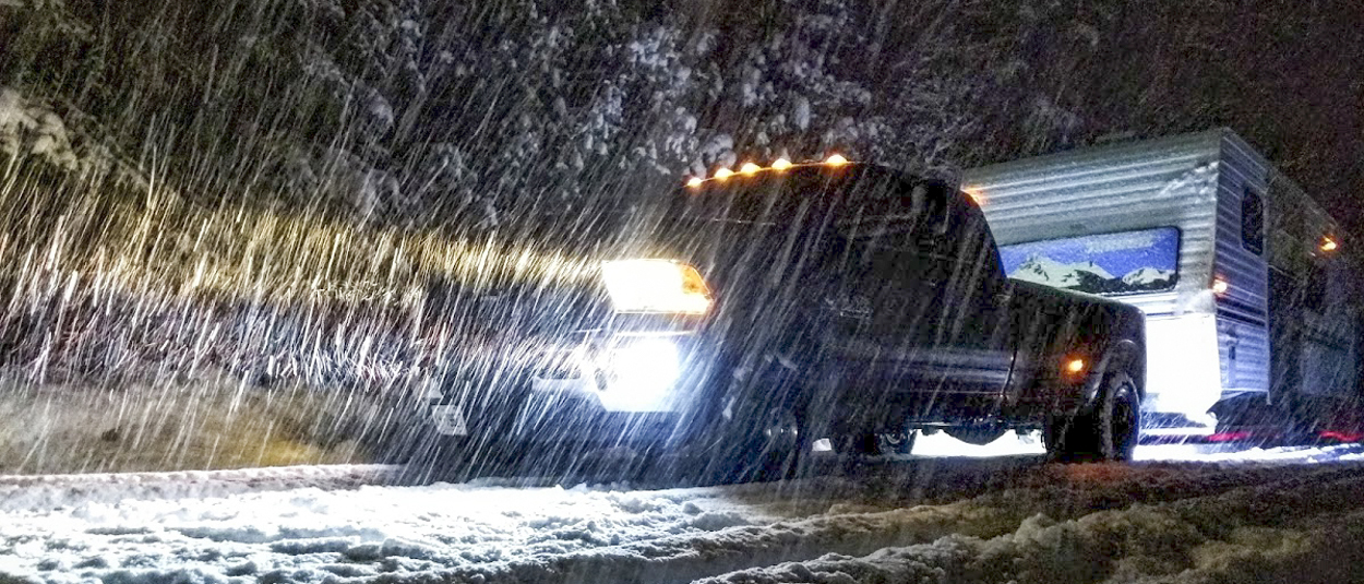 CURT hitch on Ram truck towing camper in snow