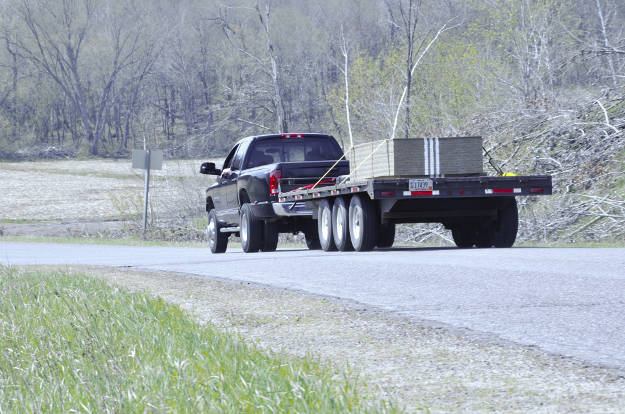 Dually Truck Towing Heavy-Duty Flatbed Trailer