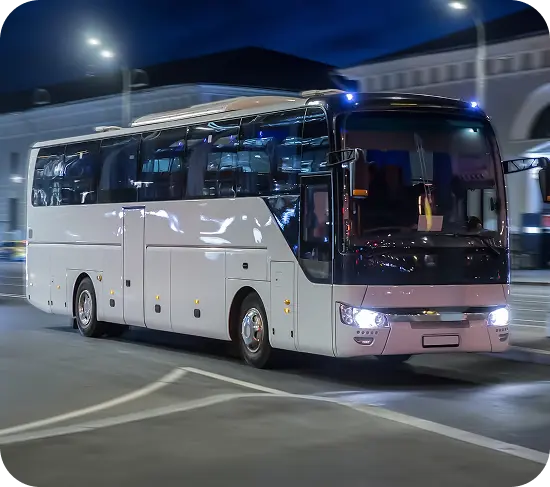 Luxury bus driving at sunset