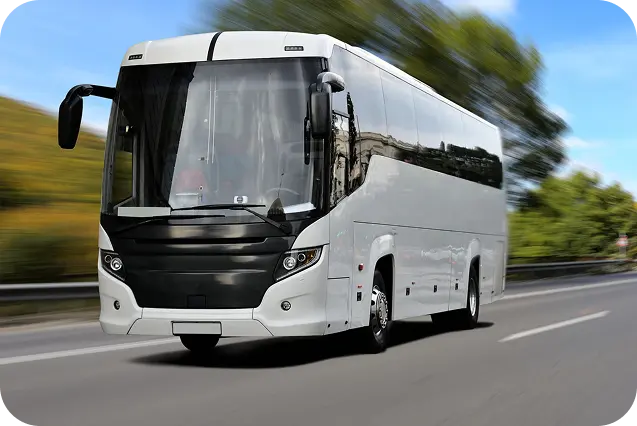 Luxury bus driving at sunset