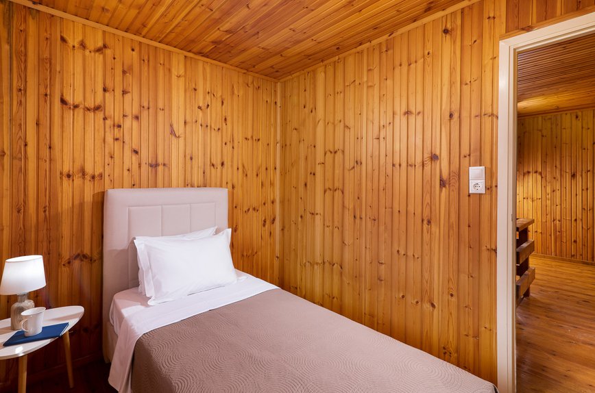 Cyan Residence, bedroom with wooden walls