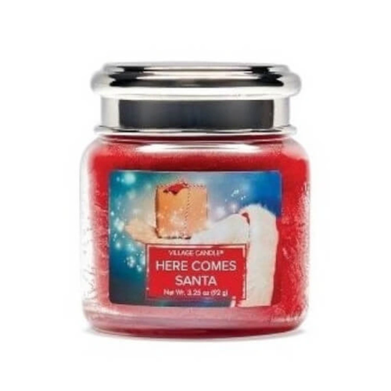 Village Candle Lumânare parfumată în sticlă Vizita lui Moș Crăciun (Here Comes Santa) 92 g