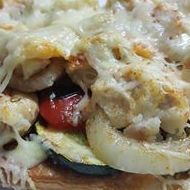 Vegetable cake with cod and melted cheese