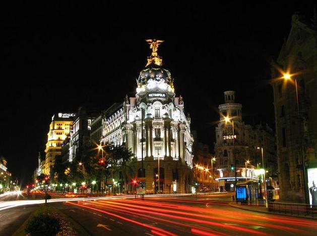 Night view of Alcalá Street and Gran Vía in Madrid.