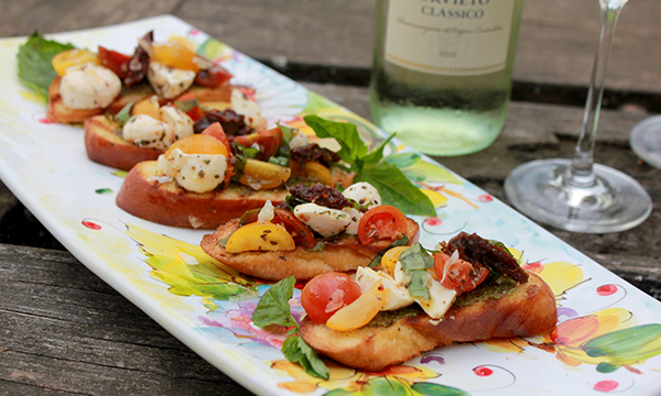 Marinated Tomato & Mozzarella Crostini with Pistachio Pesto