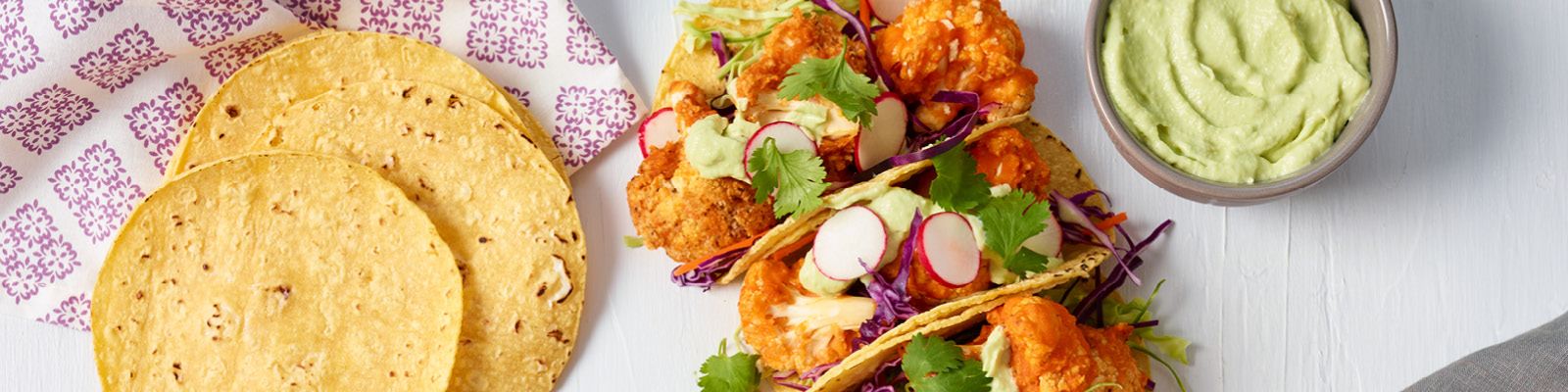 Buffalo Cauliflower Tacos with Avocado Crema 