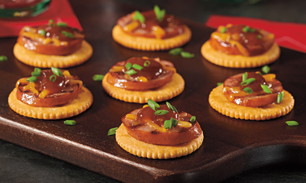 Ritz crackers topped with tukey kielbasa, cheddar cheese and barbecue sauce. 