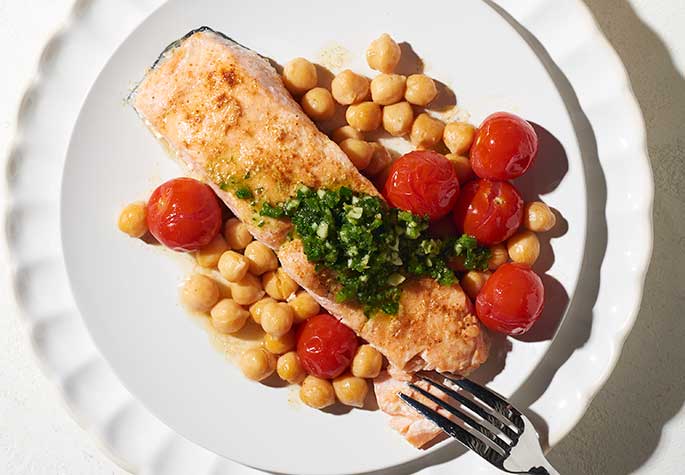 Grilled Salmon Foil Packs with Tomatoes, Chickpeas and Zhug recipe