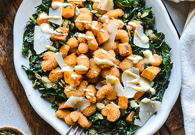 Kale Caesar Salad with Popcorn Shrimp