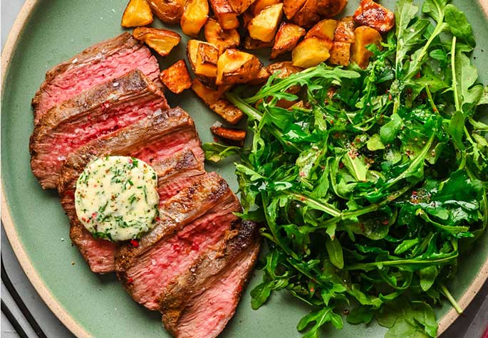 Simple Grilled Flank Steak with Garlic Herb Butter