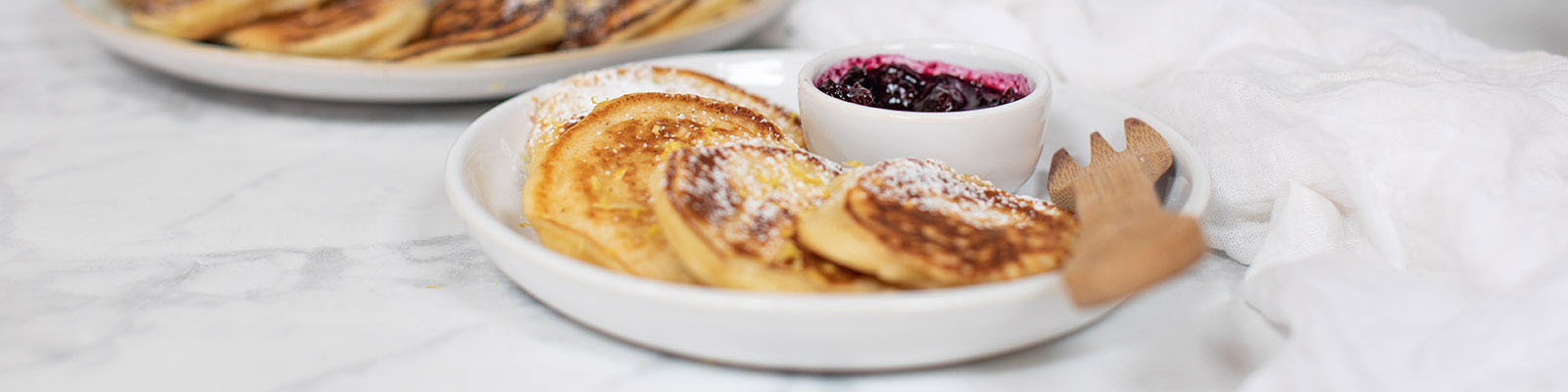 Ricotta and Lemon Mini Pancakes with Blueberry Coulis