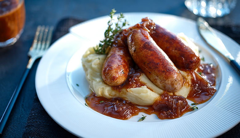 Neven Maguire's Bangers & Cheesy Mash with Caramelised Red Onion Gravy