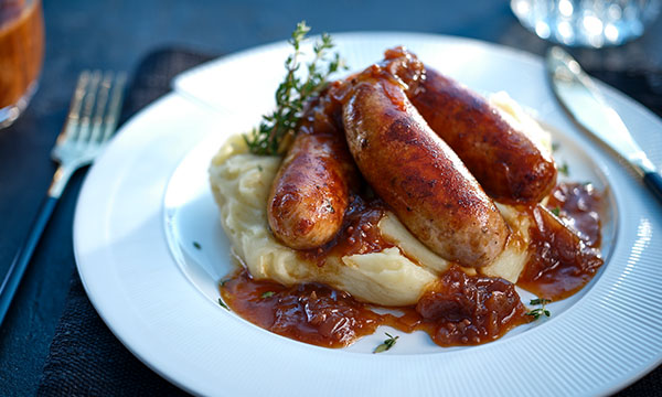 Neven Maguire's Bangers & Cheesy Mash with Caramelised Red Onion Gravy