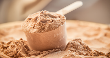 Scoop of chocolate protein powder