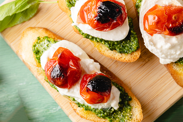 Recipe: Pesto, Burrata & Roasted Tomato Crostini