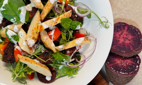 Purple sweet potato roasted and served with chicken and salad