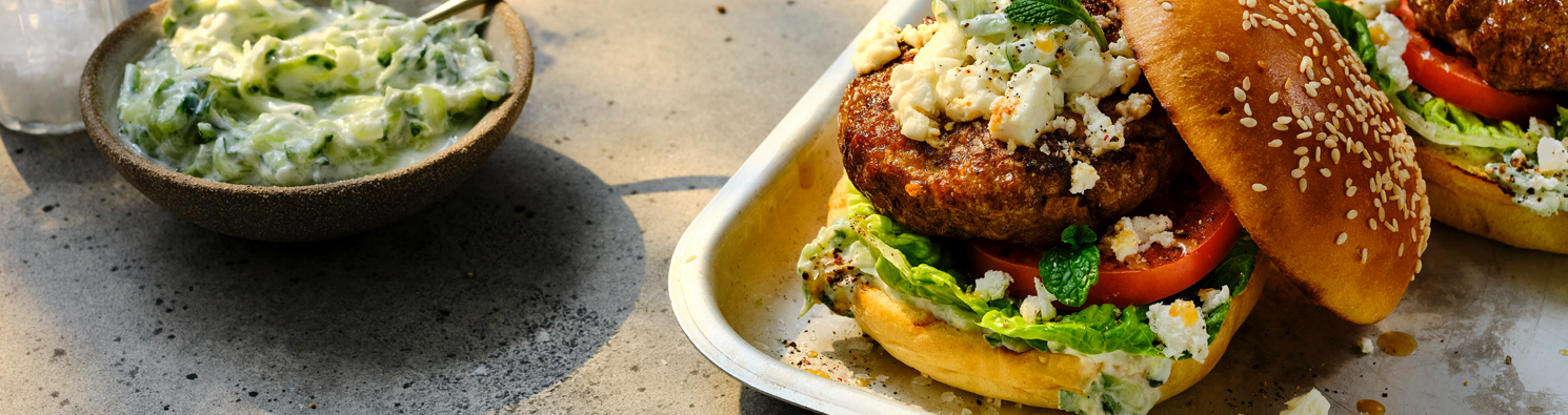 BBQ Lamb Burgers with Tzatziki, Baby Gem, Feta, and Tomato