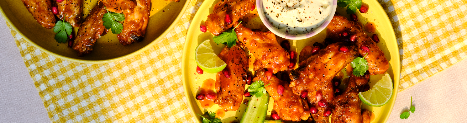 Chipotle Spiced Chicken Wings with Cashel Blue Cheese Crème Fraîche, Pomegranate, and Lime