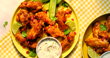Chipotle Spiced Chicken Wings with Cashel Blue Cheese Crème Fraîche, Pomegranate, and Lime