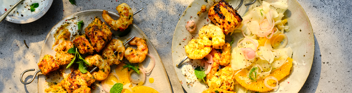 Chermoula King Prawn and Salmon Skewers with Lime Yogurt and Orange Fennel Rocket Salad