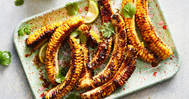 Sticky Charred Corn Ribs with a zingy coriander & lime mayo