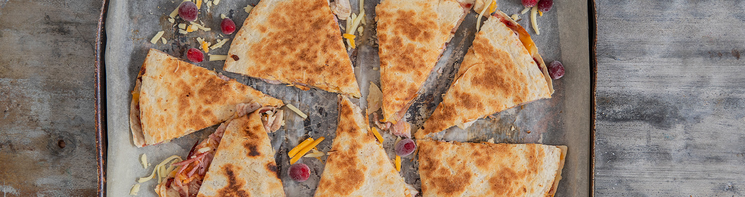 Cheesy turkey and ham quesadillas with cranberry sauce