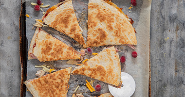 Cheesy turkey and ham quesadillas with cranberry sauce