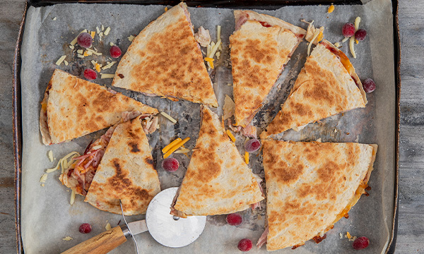 Cheesy turkey and ham quesadillas with cranberry sauce