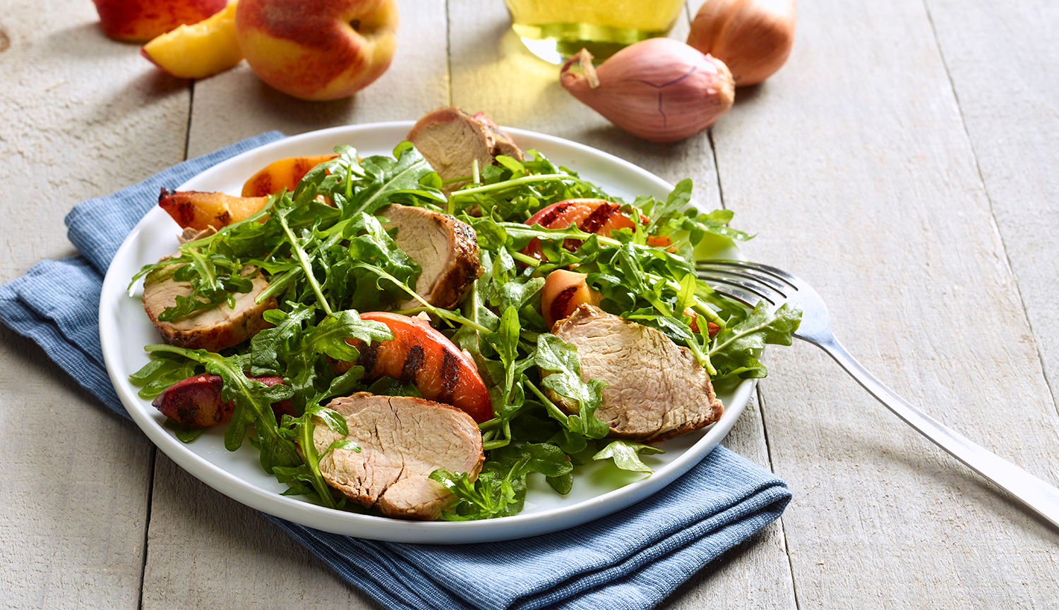 Pork Tenderloin on a Grilled Peach and Arugula Salad