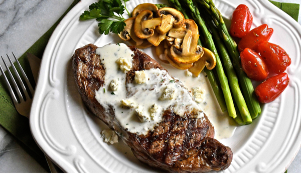 Grilled Strip Loin Steaks with Creamy Gorgonzola Sauce