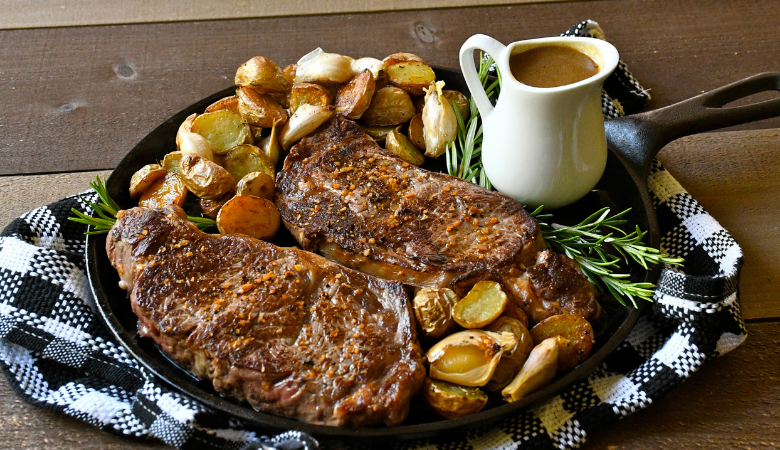 Strip Loin Steaks with Garlic Rosemary Roasted Potatoes and Jus