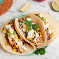 Slow Cooker Pork Carnitas with Corn Salsa and Lime Crema