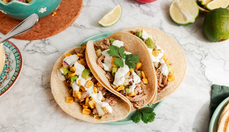 Slow Cooker Pork Carnitas with Corn Salsa and Lime Crema