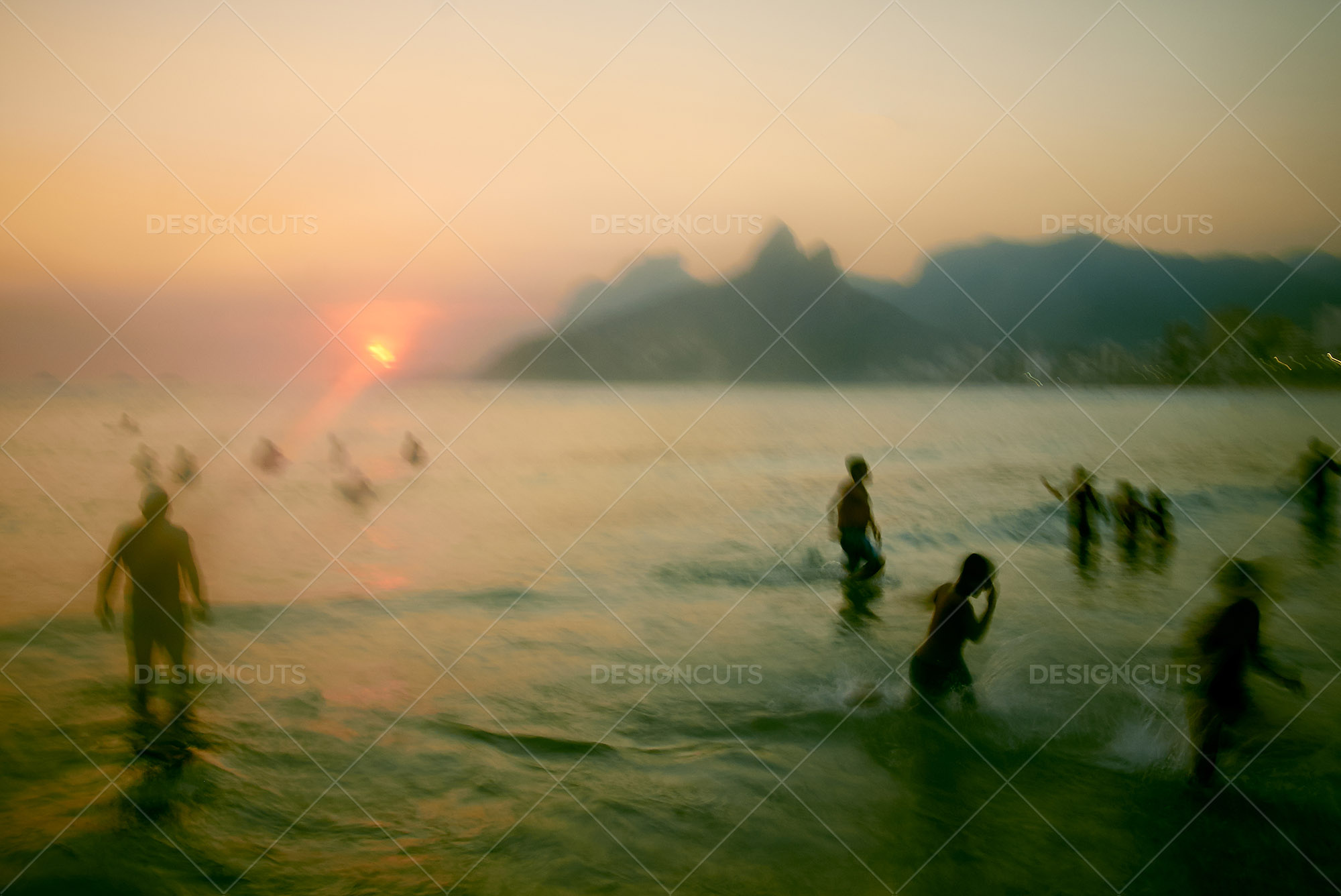 Sunset Over Motion Blurred Swimmers At Ipanema Beach, Rio