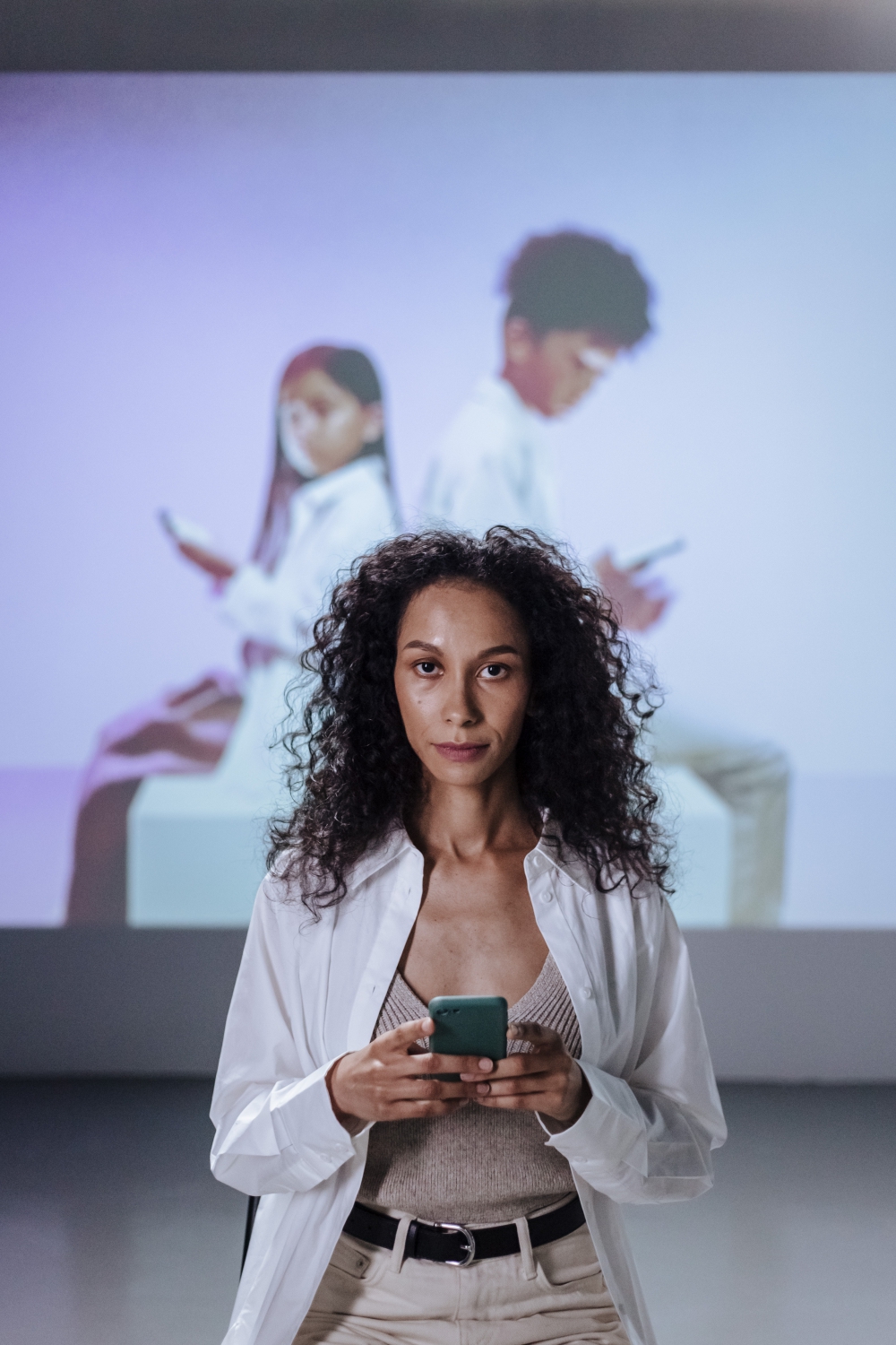 a woman using a phone and looking up