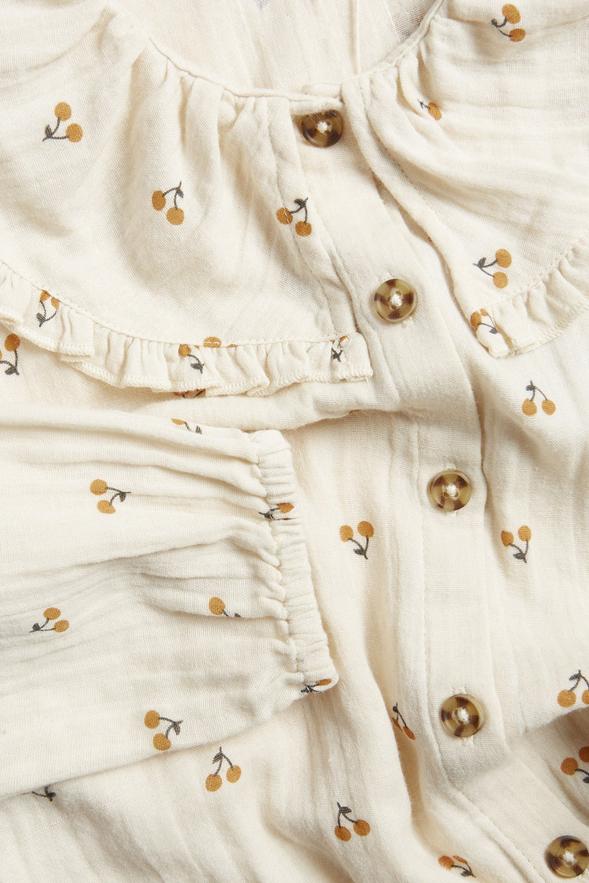 Svart barnklänning med körsbärsmotiv