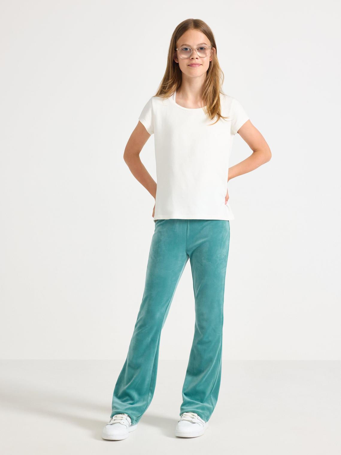 Utsvängda velourbyxor för damer