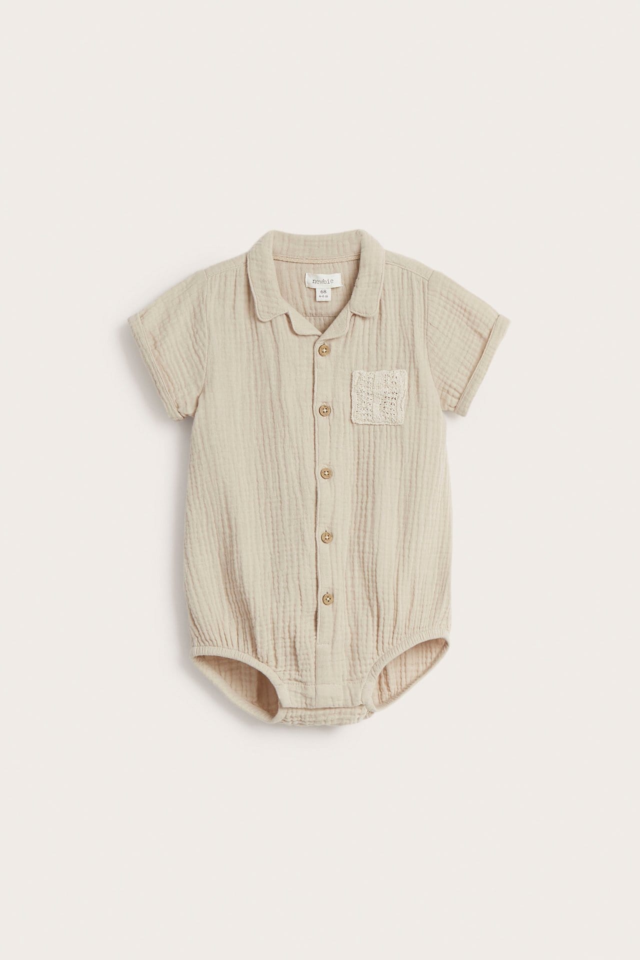 Beige kortärmad babybody med ficka