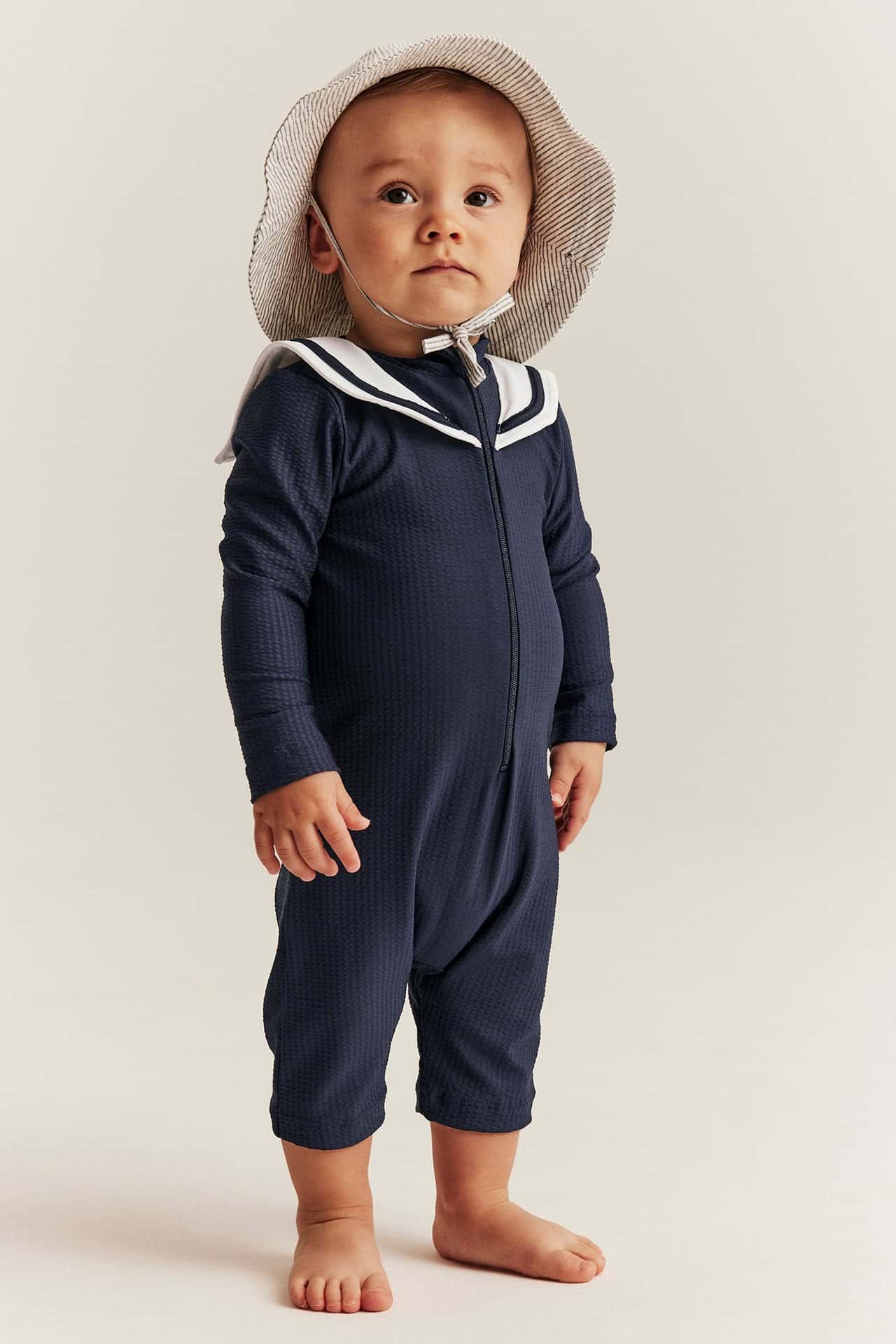 Mörkblå UV-dräkt med sjömanskrage