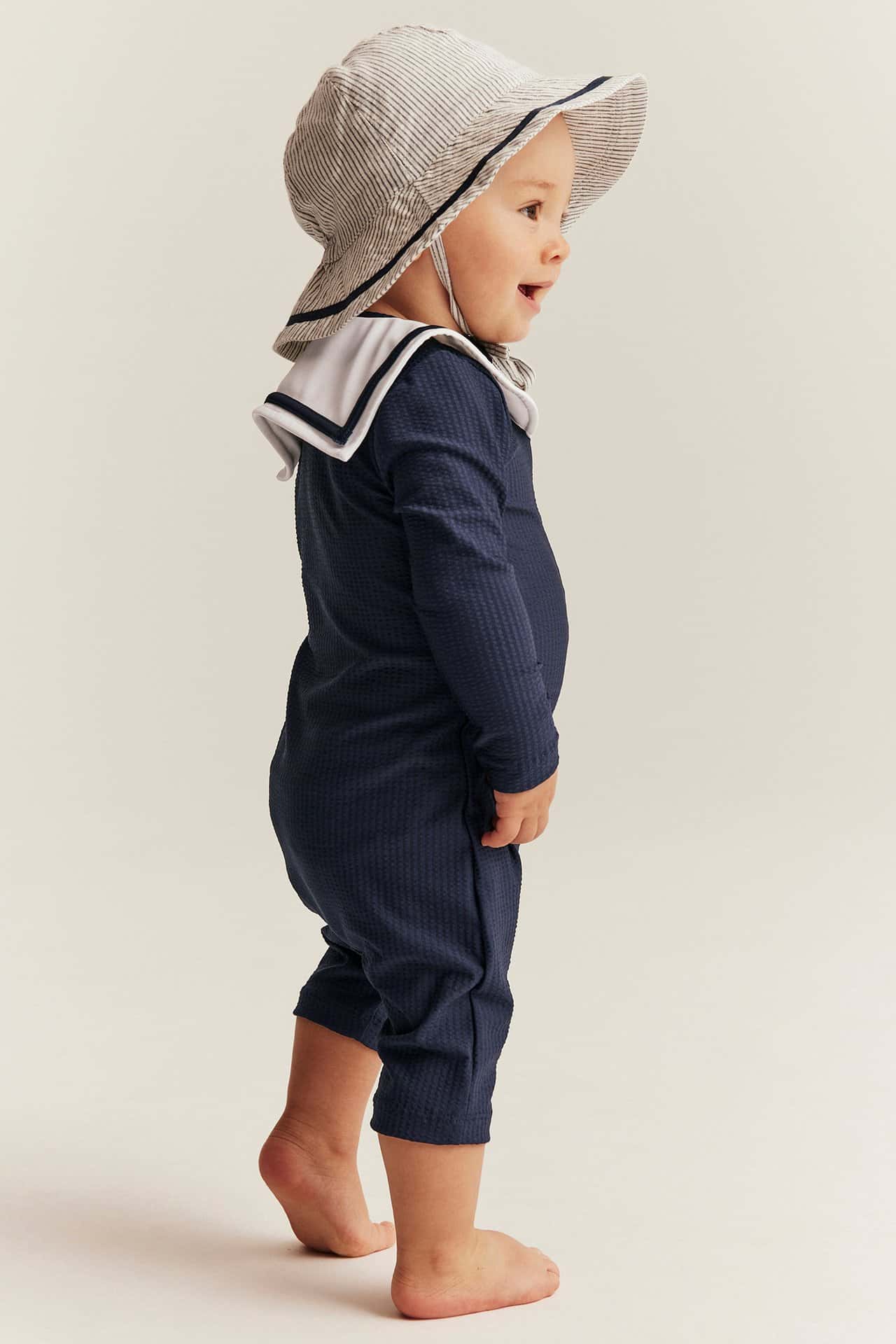 Mörkblå UV-dräkt med sjömanskrage