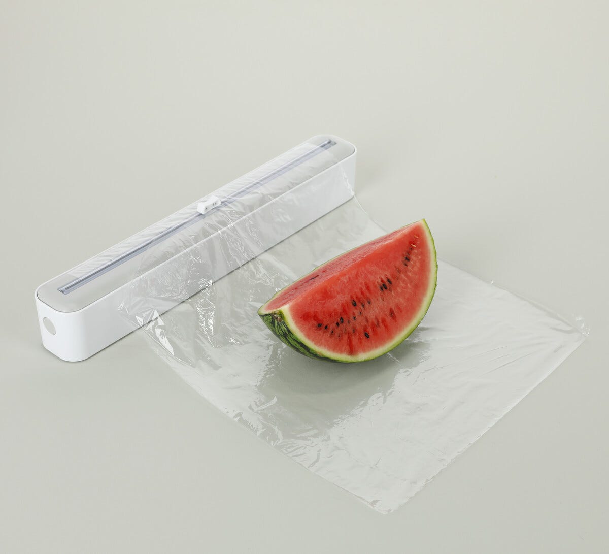 Plastfoliedispenser med inbyggd skärare