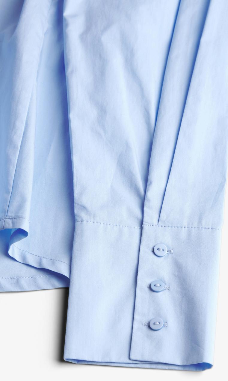 Ljusblå damskjorta med knytband